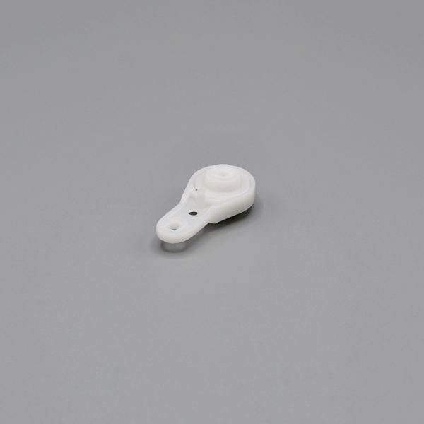A white, Fabtex drapery ball bearing carrier.