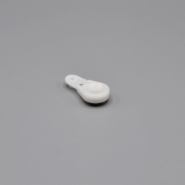 A white, Fabtex drapery ball bearing carrier.