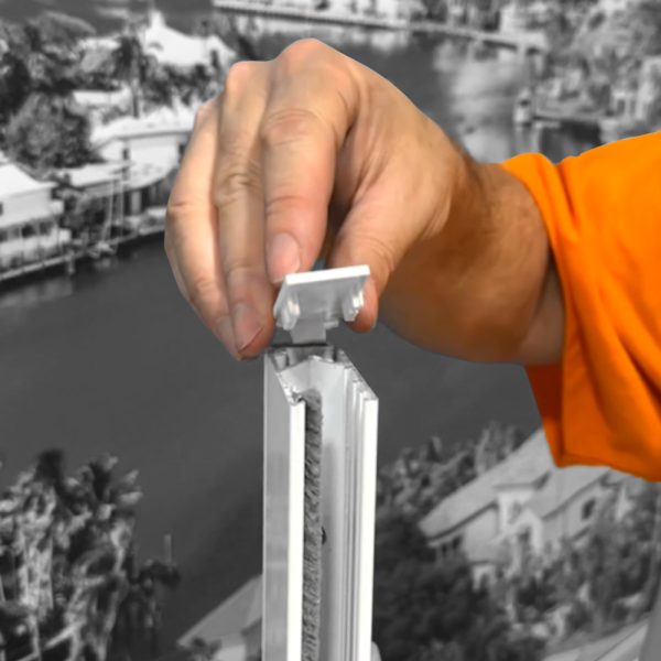 The Fabtex side channel base end cap being installed into a side channel.