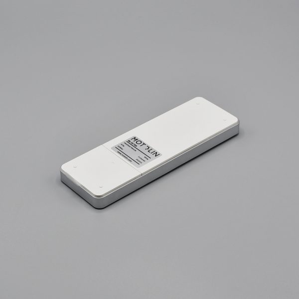 Back side view of the single-channel, Fabtex handheld remote for roller shade. Also showing the battery compartment.