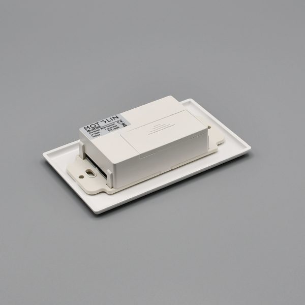 Back view of the Fabtex in-wall, single-channel remote/control for roller shades. It shows the compartment for the battery.