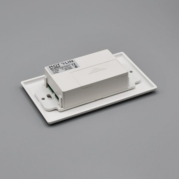 Back view of the Fabtex in-wall, 15-channel remote/control for roller shades. It shows the compartment for the battery.