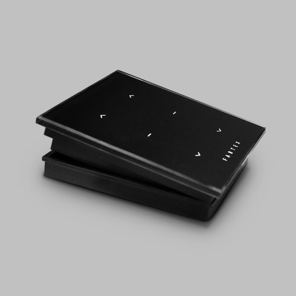 Black, Fabtex surface-mount, 2-channel control/remote for roller shades. Connects via radio frequency.